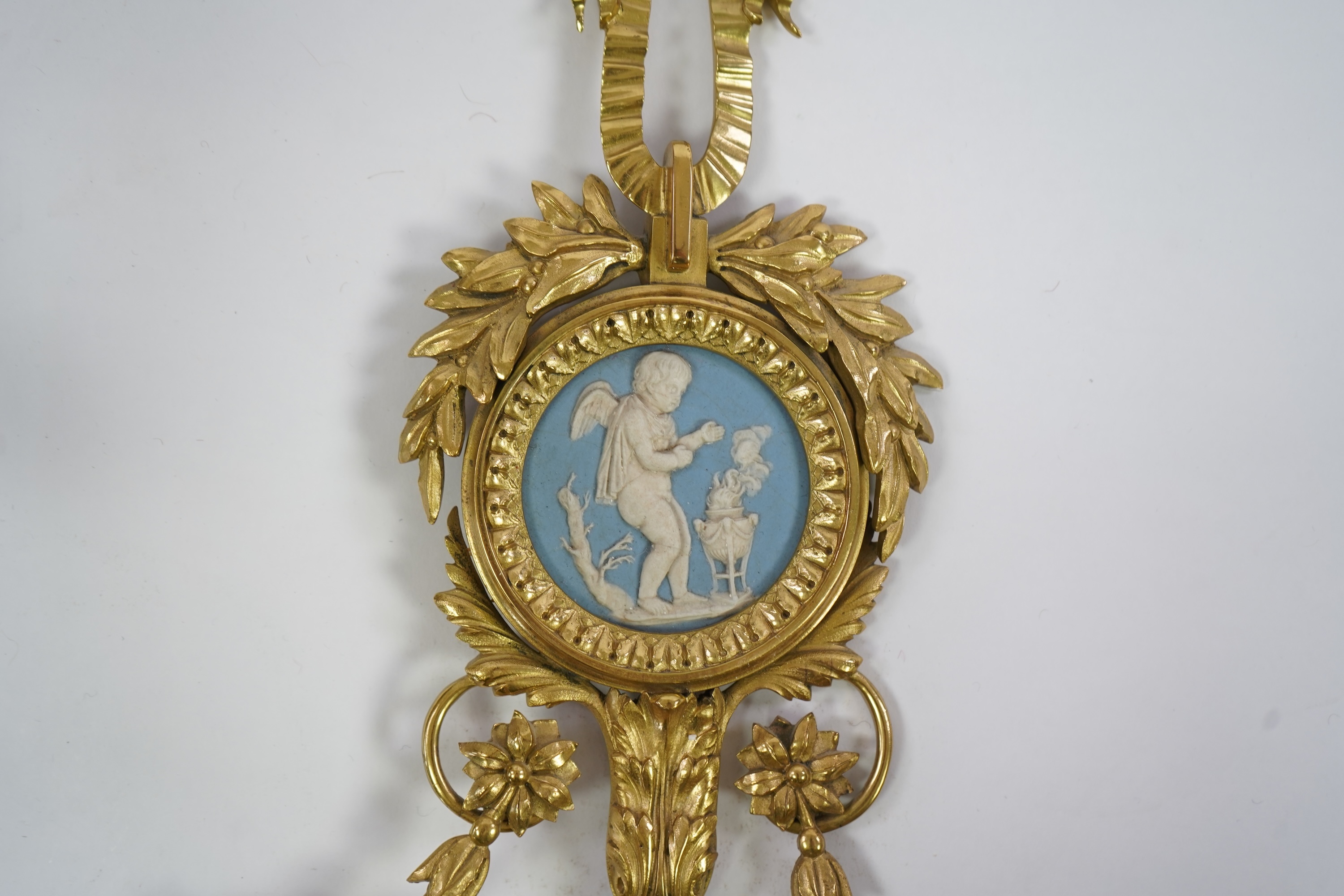 A set of four Adam style ormolu and jasper ware mounted wall appliques, early 20th century